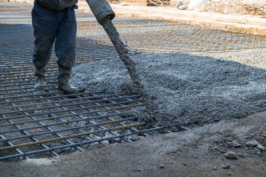 the builders poured concrete at the construction site